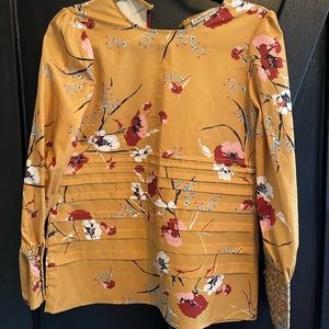 Mustard/Gold color dressy blouse with beautiful detail.